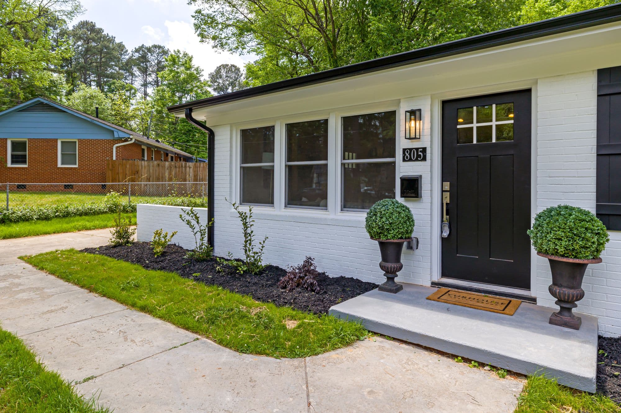 Modern front yard with landscaped entrance and fresh planting beds